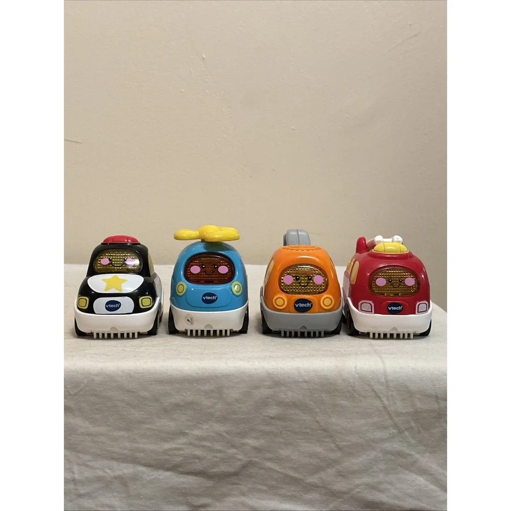 VTech Go! Go! Smart Wheels Lot of 4 Police Fire Tow Helicopter Toys